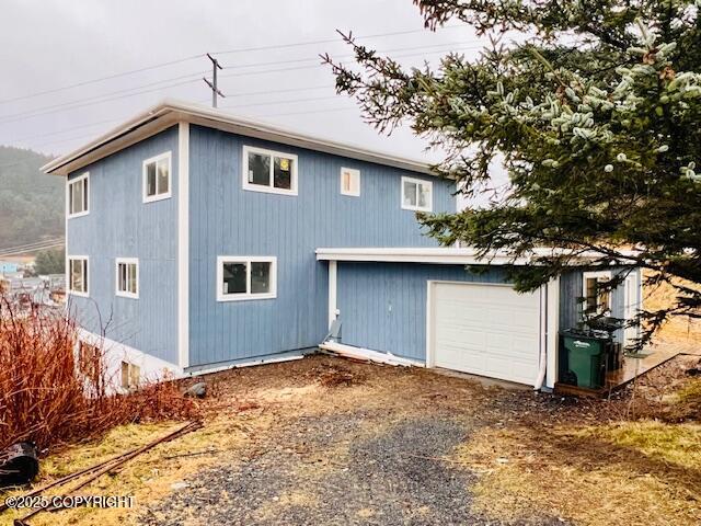 view of home's exterior with a garage