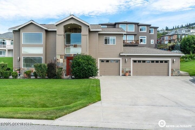 16643 Woods Pointe Cir, Anchorage, AK 99516 - view of front of property featuring driveway, a front yard, and a garage