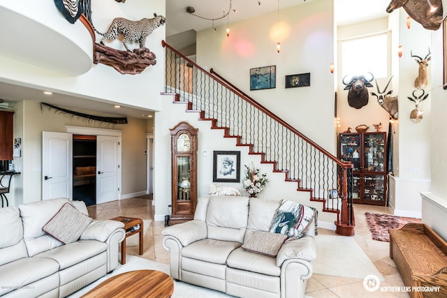 16643 Woods Pointe Cir, Anchorage, AK 99516 - living room with stairway, tile patterned floors, and a towering ceiling