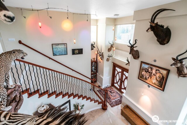 16643 Woods Pointe Cir, Anchorage, AK 99516 - staircase featuring baseboards