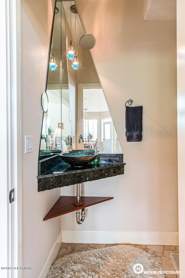 16643 Woods Pointe Cir, Anchorage, AK 99516 - bathroom featuring baseboards