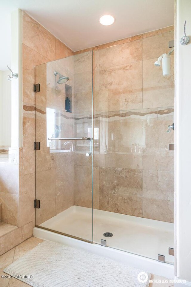 16643 Woods Pointe Cir, Anchorage, AK 99516 - bathroom featuring a stall shower, tile patterned flooring, and recessed lighting