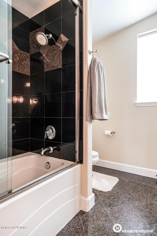 16643 Woods Pointe Cir, Anchorage, AK 99516 - bathroom featuring granite floors and bath / shower combo with glass door