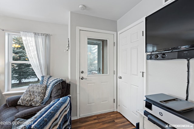 doorway to outside with dark wood-type flooring