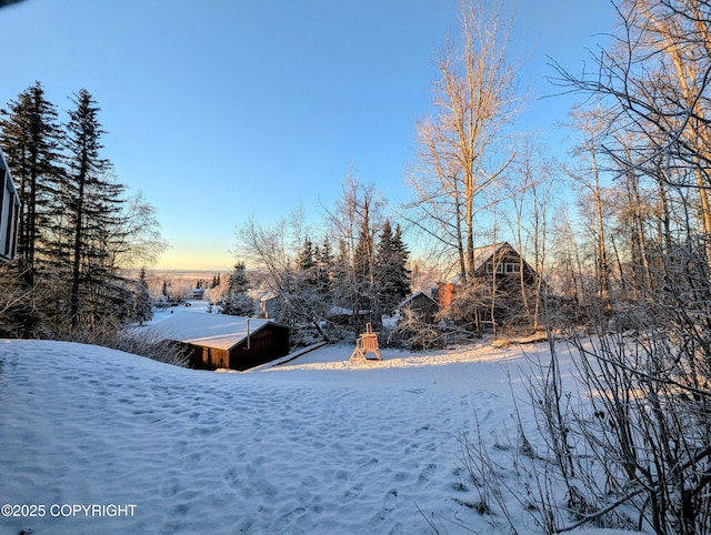 view of yard covered in snow