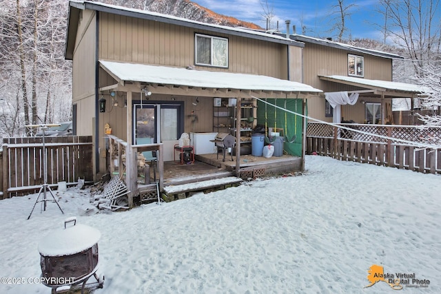 view of snow covered house