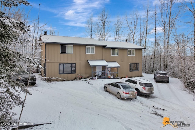 view of snow covered property