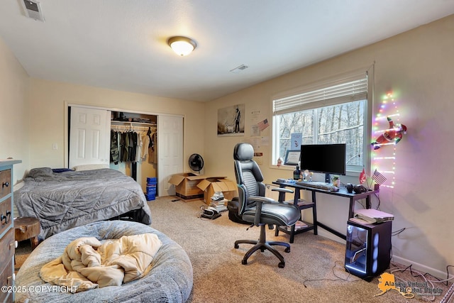 bedroom with carpet floors and a closet