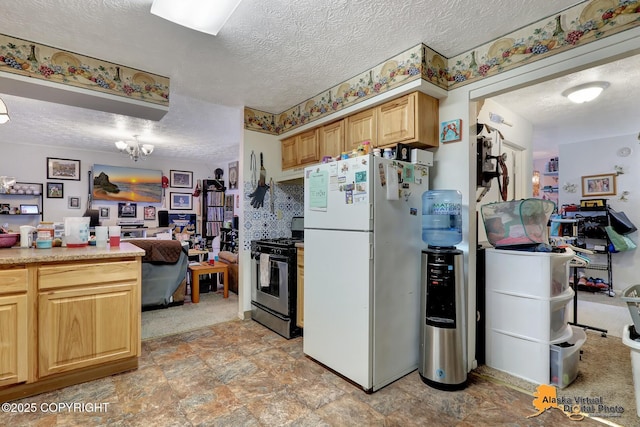 kitchen with an inviting chandelier, black electric range oven, white refrigerator, a textured ceiling, and light brown cabinetry