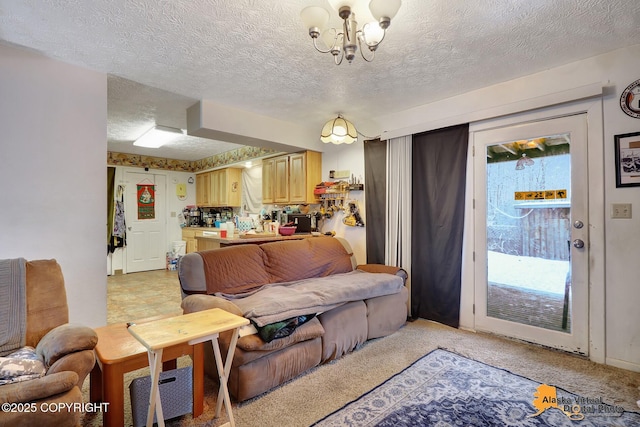 living room featuring a chandelier, light carpet, and a textured ceiling