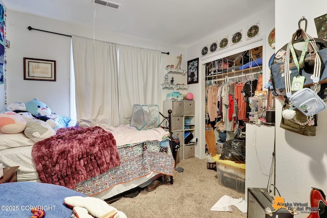 carpeted bedroom with a closet