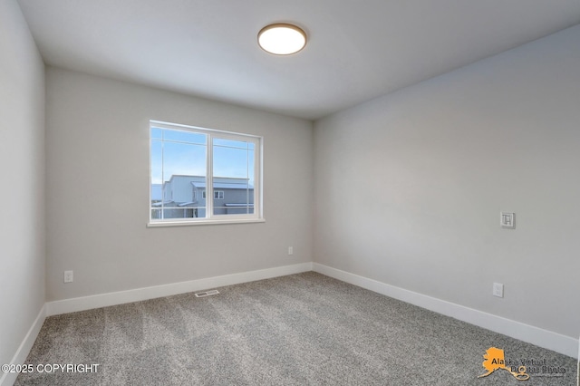8803 Chalk Hill Loop, Anchorage, AK 99502 - carpeted spare room featuring baseboards