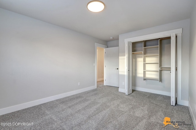 8803 Chalk Hill Loop, Anchorage, AK 99502 - unfurnished bedroom featuring carpet and a closet