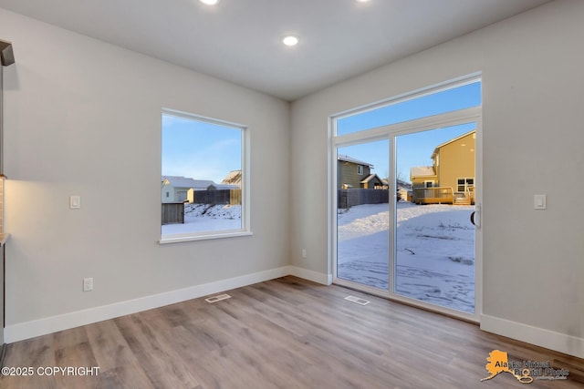 8803 Chalk Hill Loop, Anchorage, AK 99502 - unfurnished room featuring recessed lighting and wood finished floors