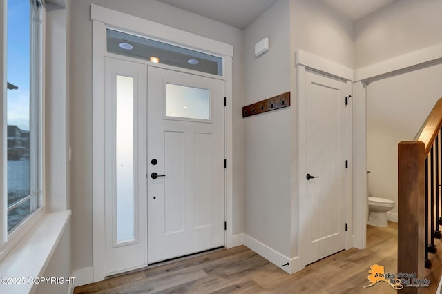 8803 Chalk Hill Loop, Anchorage, AK 99502 - foyer entrance with light wood-style flooring