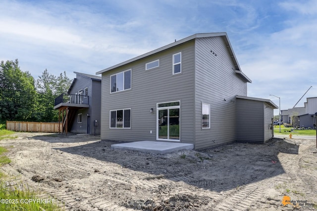 8803 Chalk Hill Loop, Anchorage, AK 99502 - back of house featuring a patio area and a deck