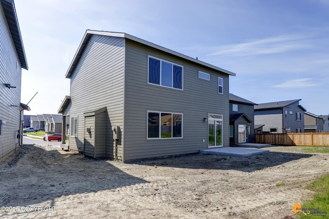 8803 Chalk Hill Loop, Anchorage, AK 99502 - back of house featuring a patio area