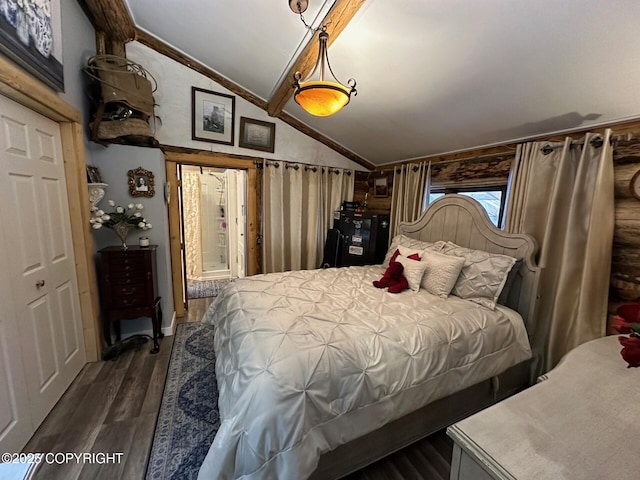 bedroom with dark hardwood / wood-style floors and vaulted ceiling