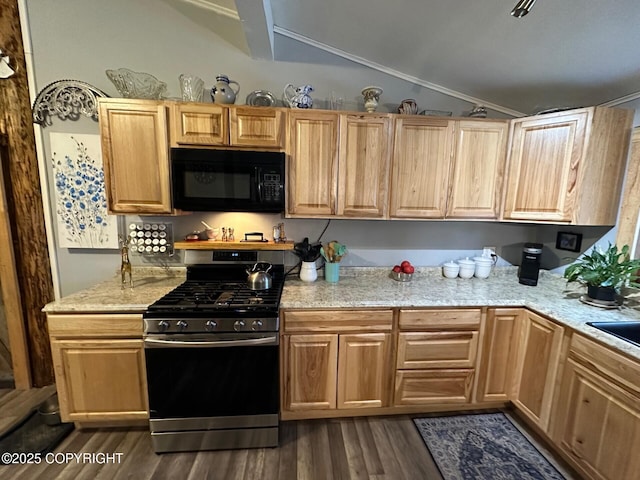 kitchen featuring lofted ceiling, light stone countertops, stainless steel gas range oven, and dark hardwood / wood-style floors