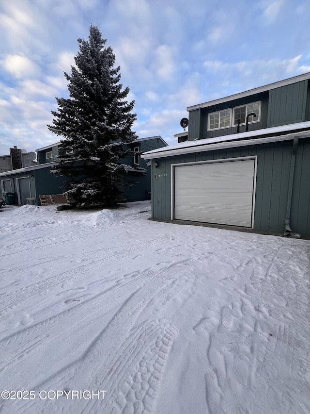 view of snow covered garage