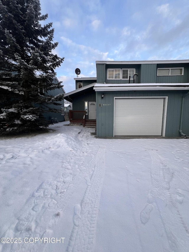 front facade with a garage