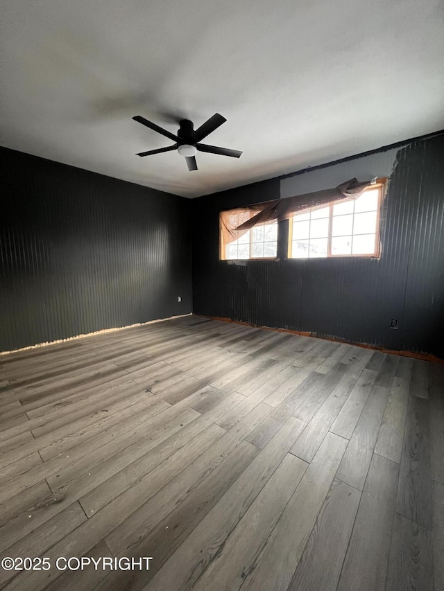 spare room with ceiling fan and light hardwood / wood-style flooring