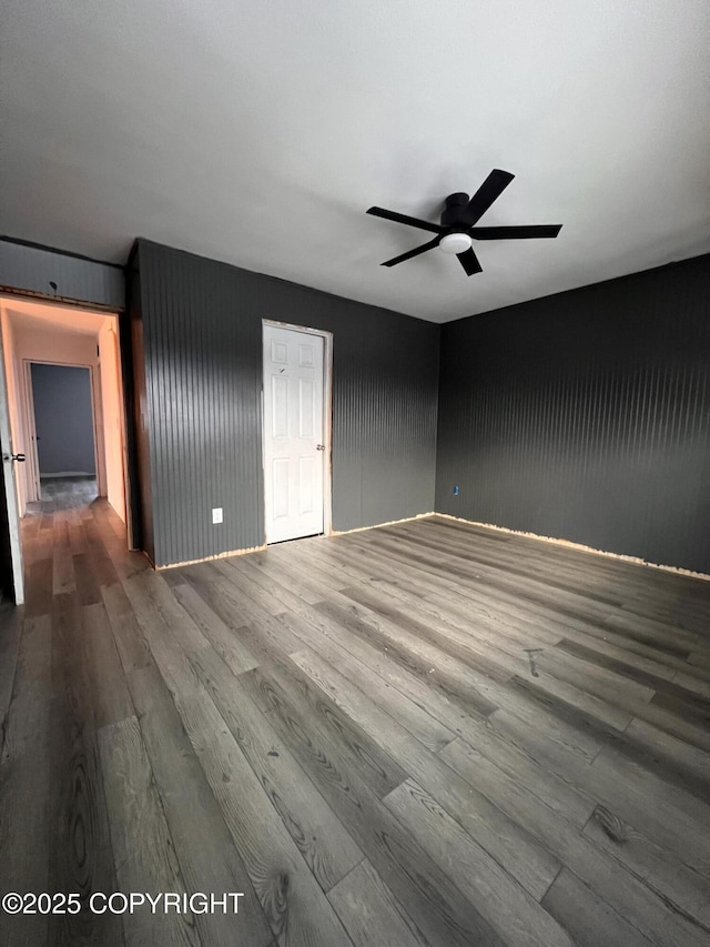 unfurnished room featuring hardwood / wood-style floors and ceiling fan