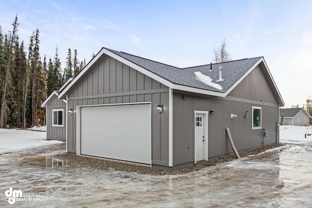 view of snow covered garage