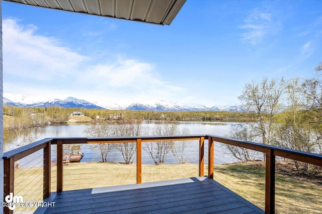 view of dock with a deck with water view