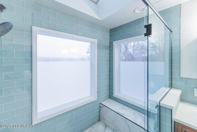 bathroom with tiled shower