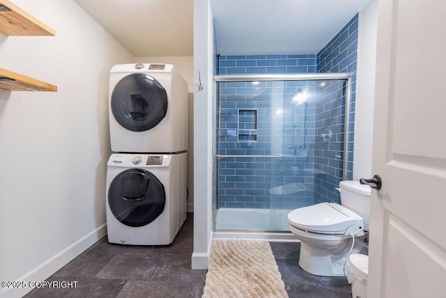 laundry area with stacked washer / drying machine