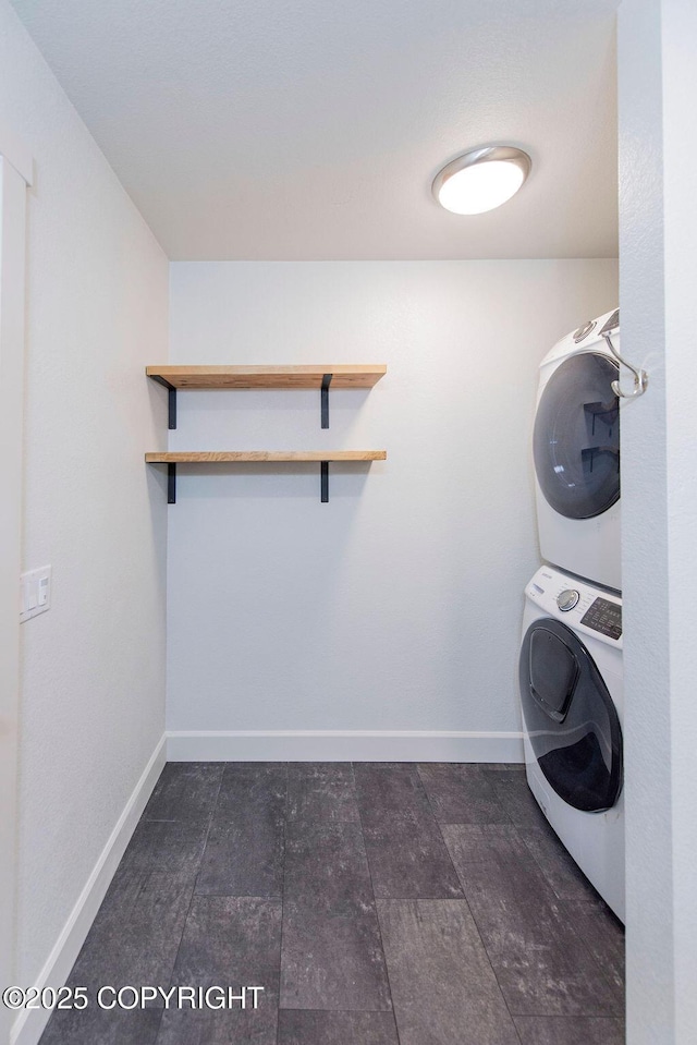 laundry room with stacked washer and clothes dryer