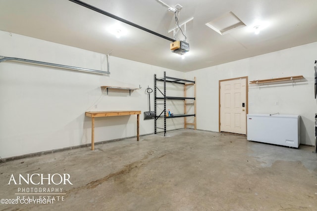 garage with a garage door opener and fridge