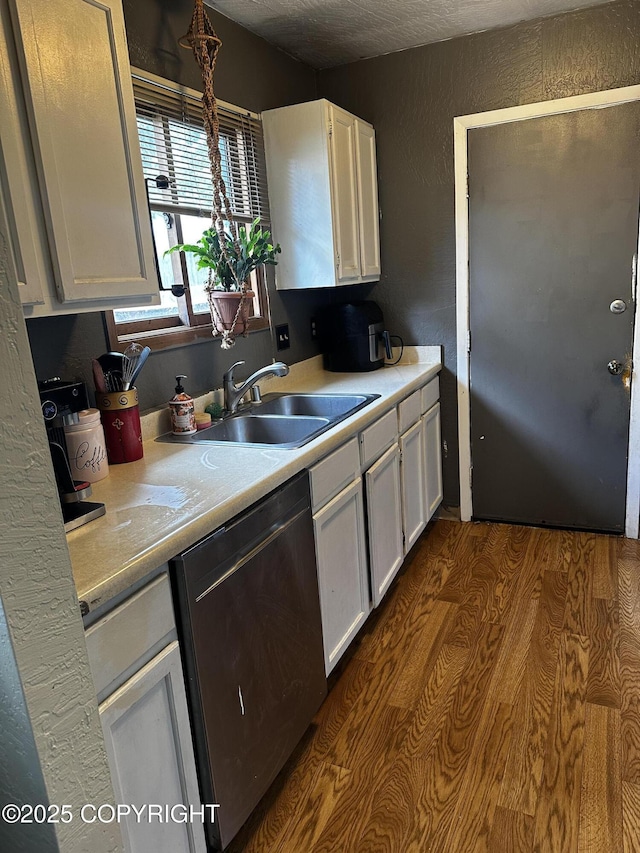 8281 Stratton Cir, Anchorage, AK 99507 - kitchen featuring dishwasher, white cabinets, light countertops, and dark wood finished floors