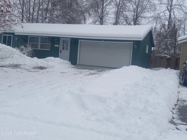 single story home featuring a garage