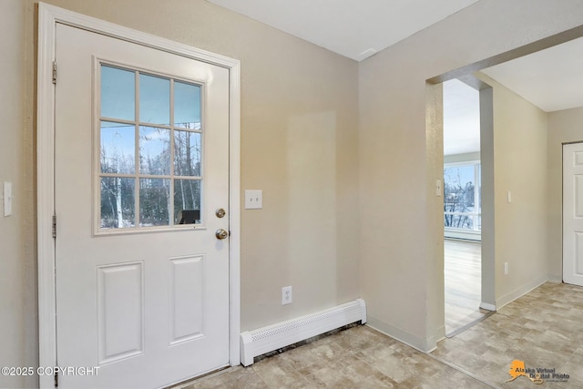 entryway with a baseboard heating unit