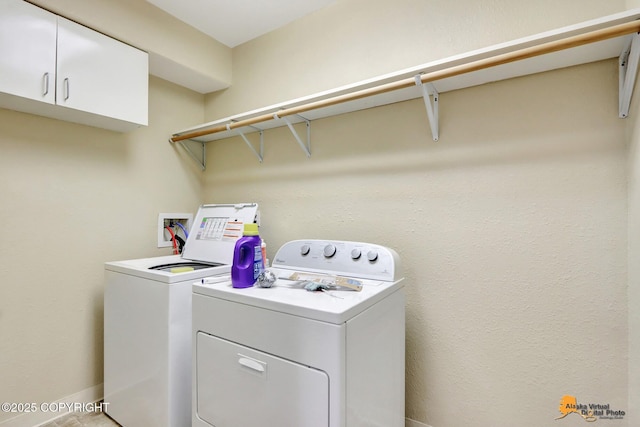 laundry room with independent washer and dryer