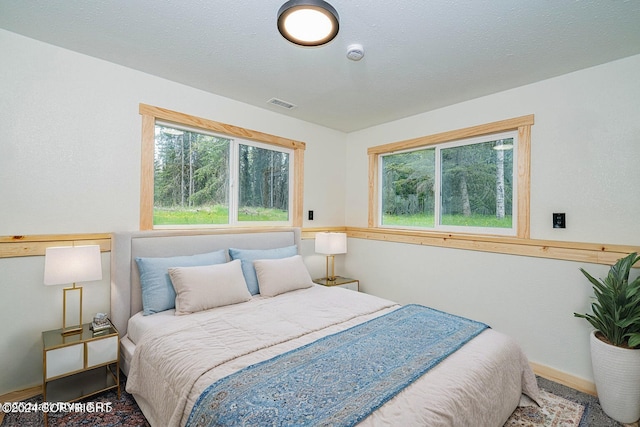 bedroom with multiple windows