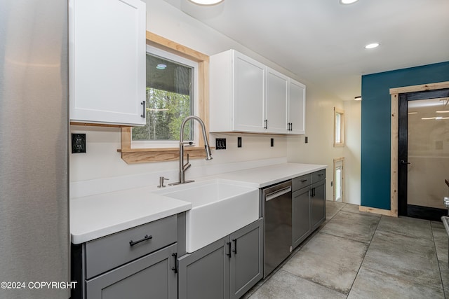 kitchen featuring dishwasher, gray cabinets, white cabinetry, and sink