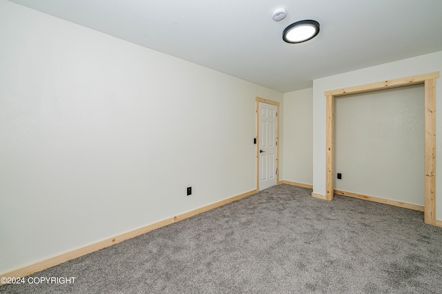 unfurnished bedroom with carpet and a closet