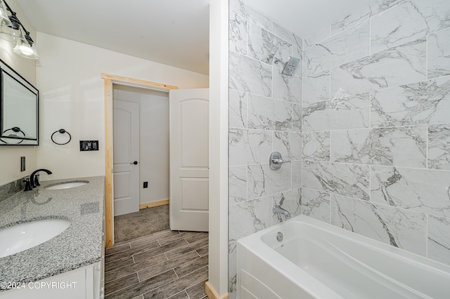 bathroom featuring vanity and tiled shower / bath combo