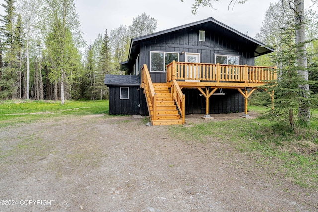 view of front of property with a wooden deck