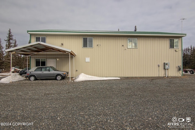 view of side of property featuring a carport