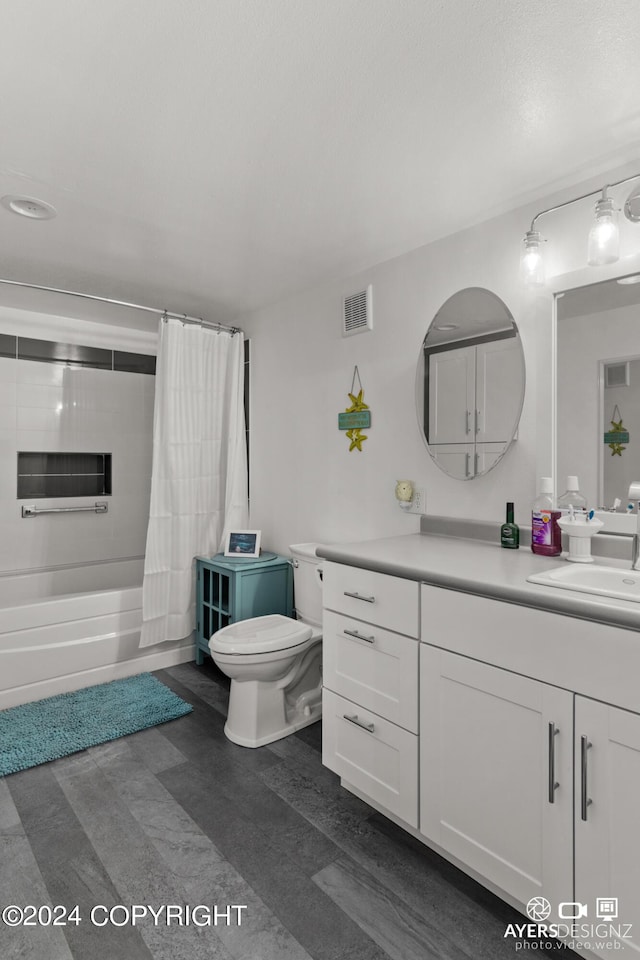 full bathroom featuring shower / tub combo with curtain, vanity, and toilet