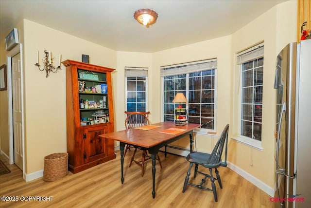 office area with light hardwood / wood-style flooring