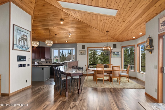 dining area with a healthy amount of sunlight, wood ceiling, dark hardwood / wood-style floors, and an inviting chandelier