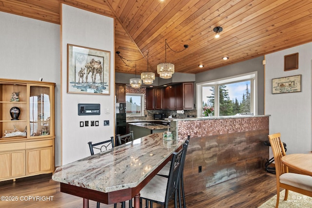 dining space featuring hardwood / wood-style flooring, lofted ceiling, wooden ceiling, and an inviting chandelier