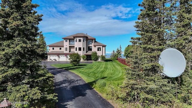 36575 Chinulna Dr, Kenai, AK 99611 - view of front of house featuring an attached garage and driveway