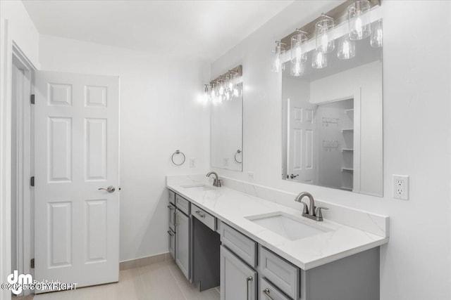 bathroom featuring tile patterned flooring and vanity