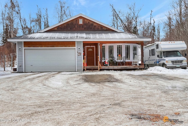 view of front of house featuring a porch and a garage